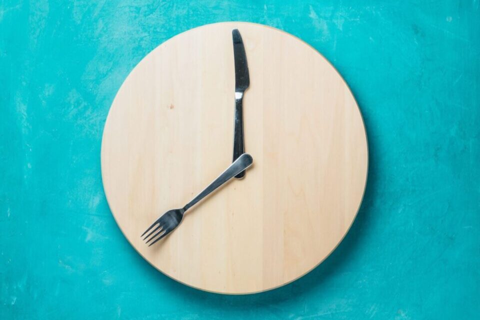 Diet's impact on Longevity - a clock with a fork and knife